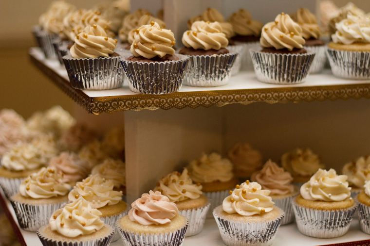 Shelves full of frosted cupcakes